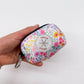 Floral dog poop bag holder Blossom Dreams holded in hand
