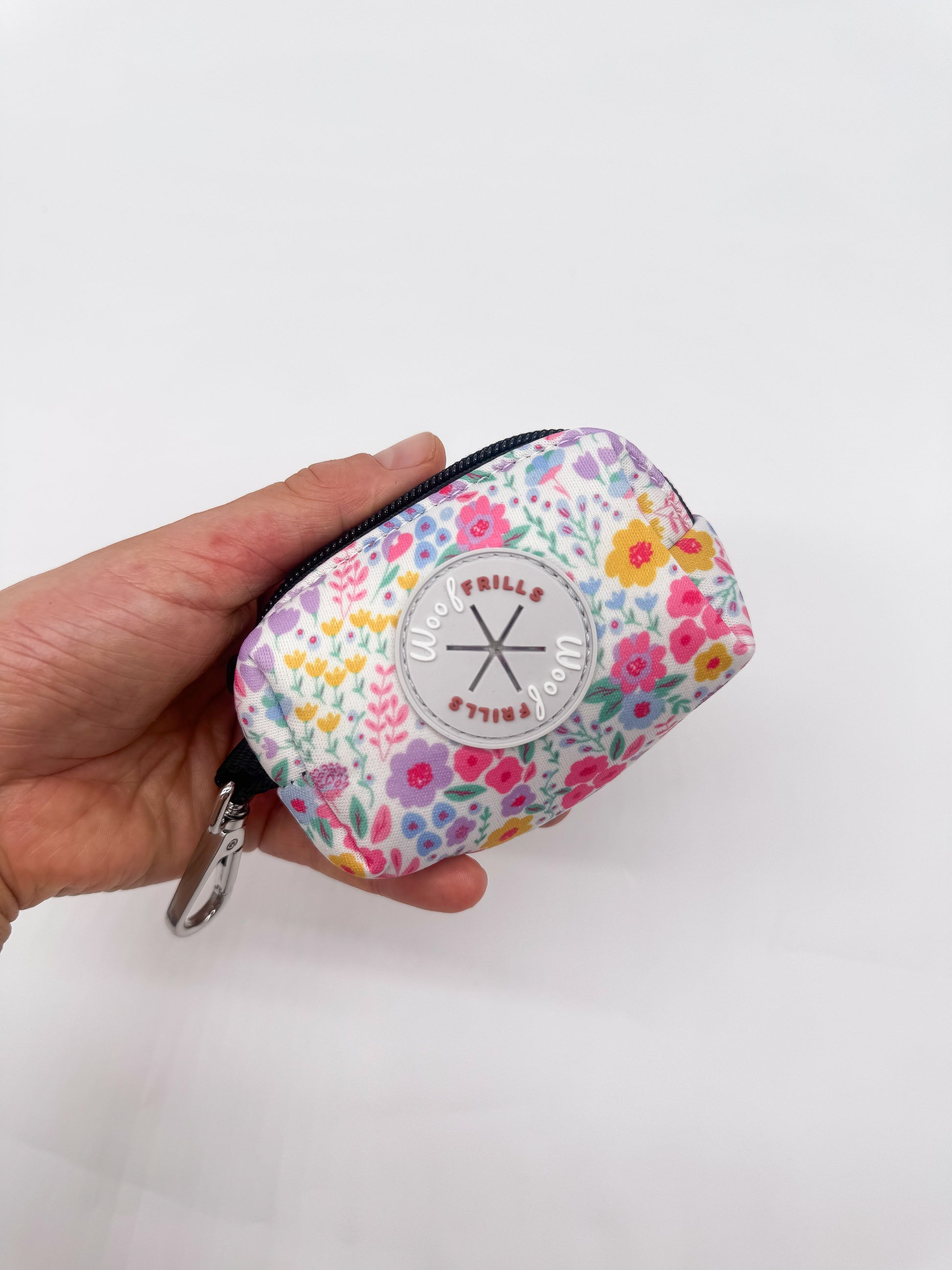 Floral dog poop bag holder Blossom Dreams holded in hand
