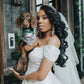 Beautiful wedding picture with a dog wearing a dog tuxedo