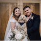 Beautiful family wedding picture and a cute dog wearing a cute dog tuxedo