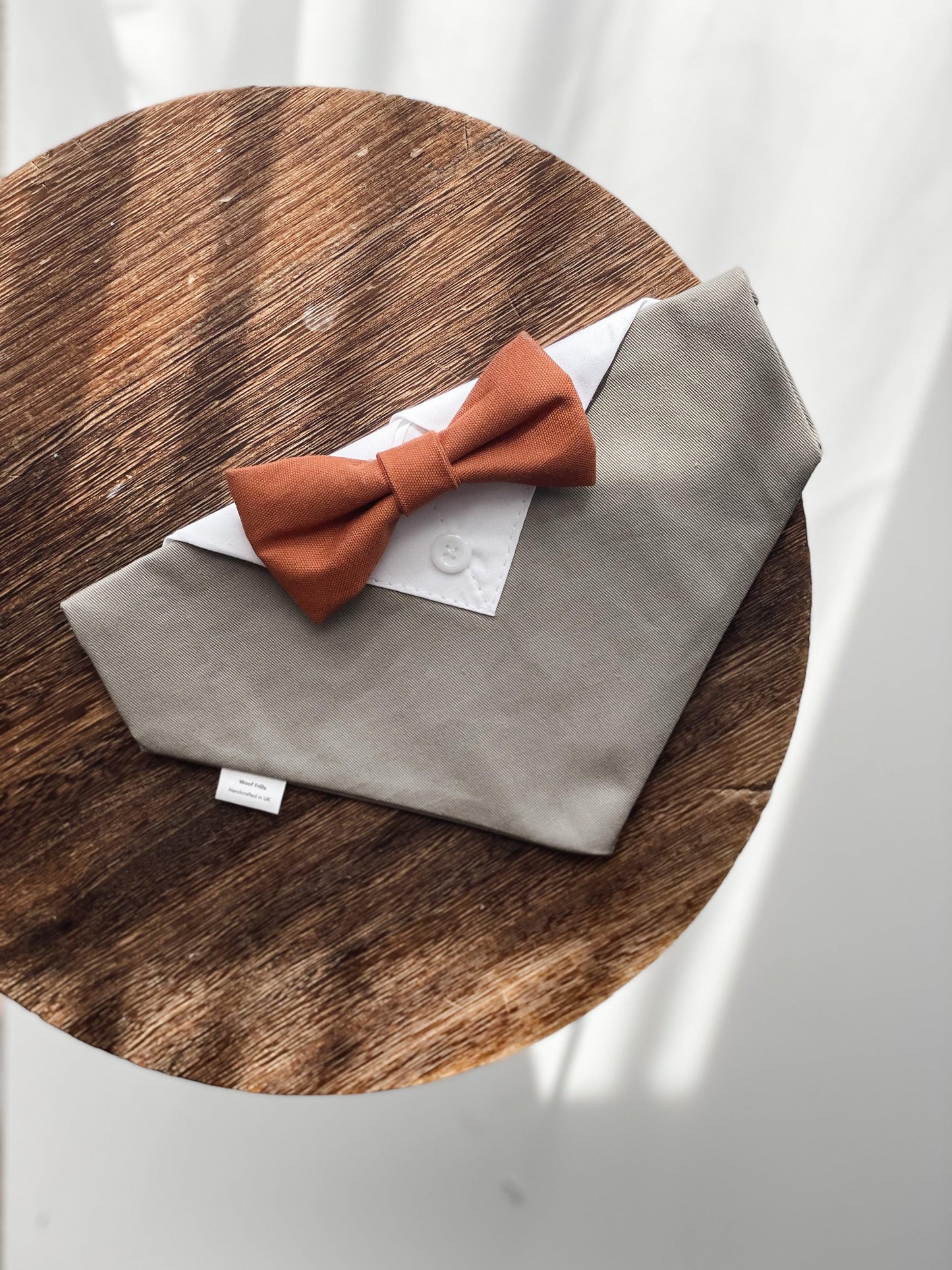 Beige wedding outfit with rust orange bow tie 